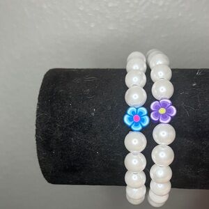 White Beaded Bracelets with Flower Accents